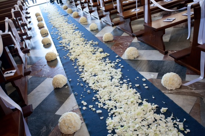 church flowers petals on aisle