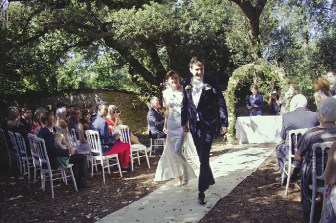 arch of flowers Tuscan wedding ceremony